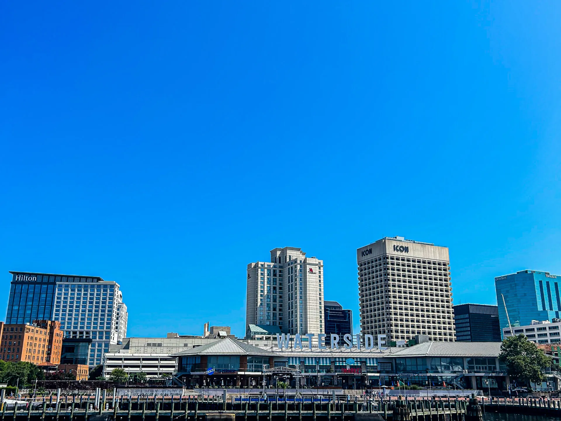 a large body of water with a city in the background